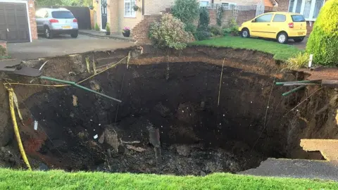 Hertfordshire Fire and Rescue Service A so-called sinkhole in Fontmell Close, St Albans