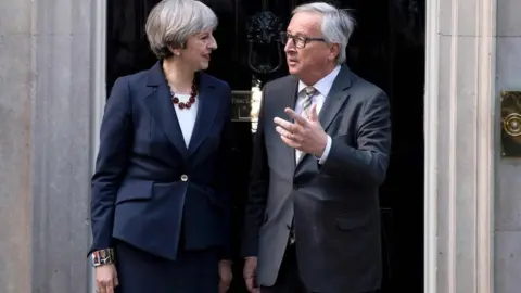 AFP/Getty Theresa May and Jean-Claude Juncker