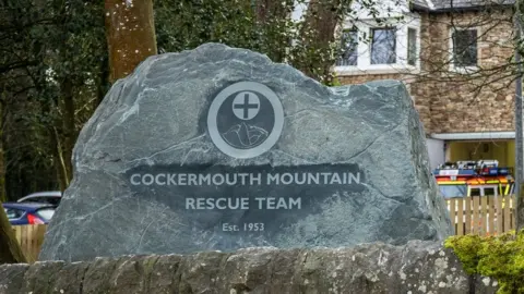 Cockermouth MRT Close up of a large stone with the team's name, logo and year of foundation carved into it