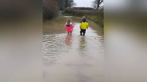 Jacovia Downing Children in flood water