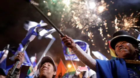 Reuters Supporters of Bolivia's President Evo Morales wave flags during a closing campaign rally in El Alto