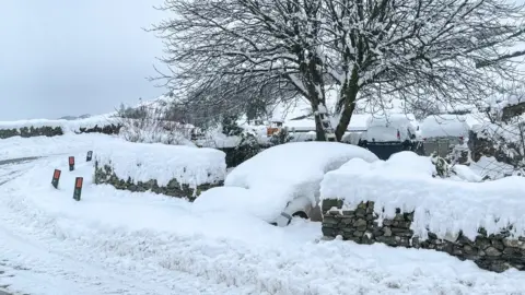 JUDITH MORRIS Heavy snow on a road in Cumbria