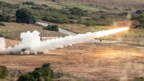 US Military US M142 High Mobility Artillery Rocket System / HIMARS firing a rocket during exercises, California, 2019