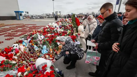 Shutterstock People gathered outside the Crocus venue to pay their respects to the victims of the attack on 22 March