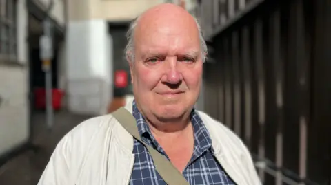 Head and shoulders shot of 78-year-old Roger Coonie