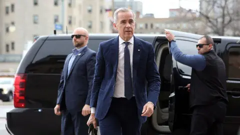 Canada's Prime Minister Mark Carney arrives at his office on Parliament Hill April 29, 2025 in Ottawa, Canada. Prime Minister Mark Carney pledged Tuesday to beat the United States in Donald Trump's trade war after winning Canada's election and leading his Liberal Party to another term in power.