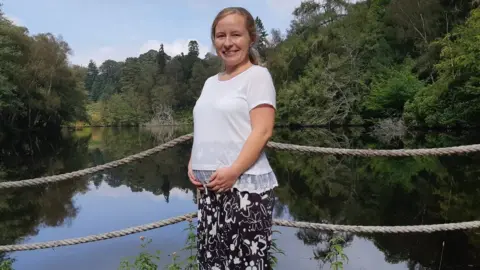 Robert Miller and Katie Fowler Katie Fowler with her hands on her baby bump