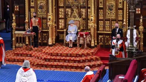 Getty Images Queen Elizabeth II reads the Queen's Speech on the The Sovereign's Throne in the socially distanced House of Lords chamber