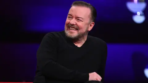 PA Media Ricky Gervais during the filming for the Graham Norton Show at BBC Studioworks 6 Television Centre, Wood Lane, London, to be aired on BBC One on Friday evening. Picture date: Thursday December 7th, 2023