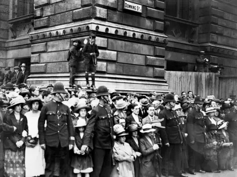 AFP via Getty Images Days after the truce, Irish people held vigils in Downing St, praying for a peaceful outcome to political talks