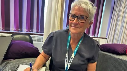 BBC Lyn writing on paper