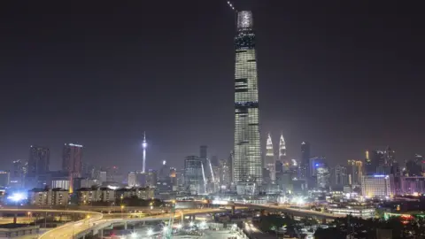 Getty Images Kuala Lumpur city skyline with the Tun Razak Exchange Tower in view in 2018