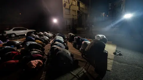 BBC/Shiraaz Mohamed Worshippers during dhikr in Manenberg, Cape Town - South Africa