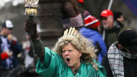 Reuters Leigh Ann Luck dressed up as the Statue of Liberty shouts as supporters of President Donald Trump gather near the Capitol building in Washington