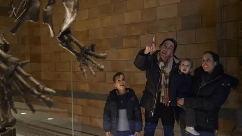 Janie Airey Art Fund A family visiting the National History Museum