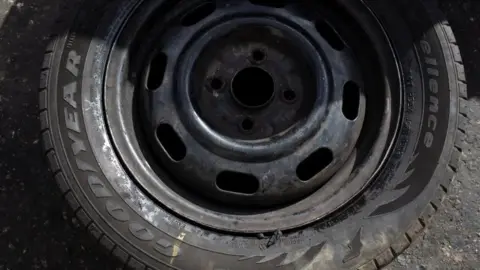 Reuters A Goodyear tyre at a workshop in Caracas, Venezuela. Photo: 10 December 2018