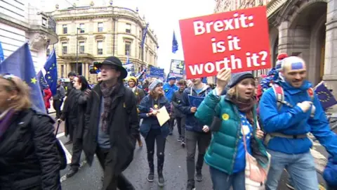 BBC People marching through Leeds with anit-anti placards