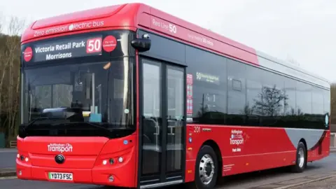 A red Nottingham City Transport bus