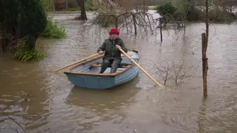 Serena Schellenberg rowing a boat in her back garden in East Sussex