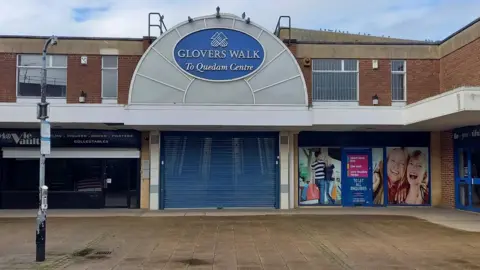 BBC Shopping centre in Yeovil with shutters down and shops closed