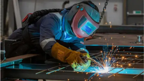 Getty Images A factory worker