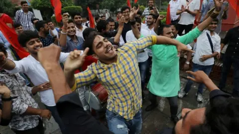 Reuters Supporters of the ruling BJP's student wing celebrate in Delhi