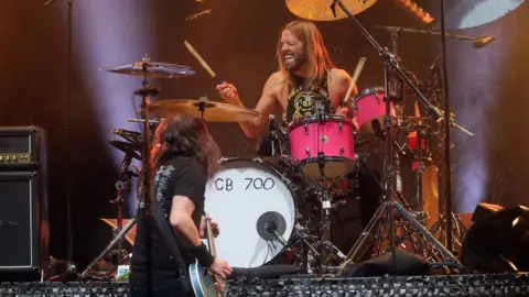 Getty Images Dave Grohl and Taylor Hawkins perform together