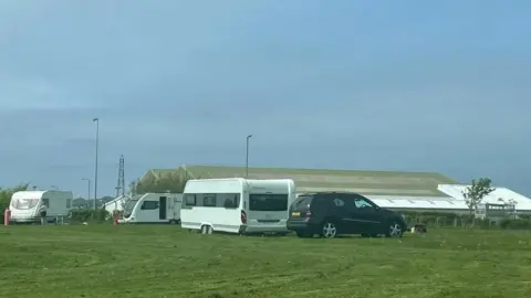 BBC Travellers at an encampment off Long Croft Road, Ormsgill, Barrow, in May