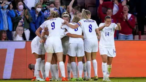 PA Media England players celebrate after team-mate Lucy Bronze scores their side's second goal of the game during the UEFA Women's Euro 2022 semi-final match at Bramall Lane, Sheffield