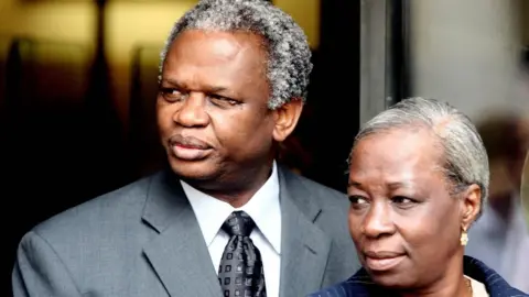 PA Media Mr and Mrs Taylor outside the Old Bailey