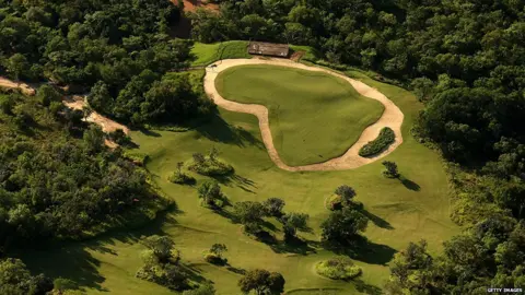 Getty Images Once they've teed off at the "Extreme 19th" golfers must fly down to the green by helicopter