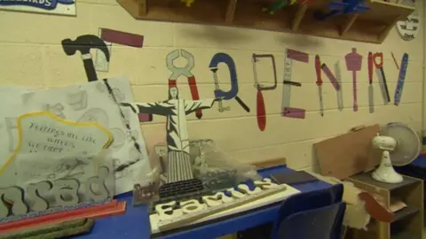 The carpentry room with "carpentry" written on the wall with the letters formed from tools