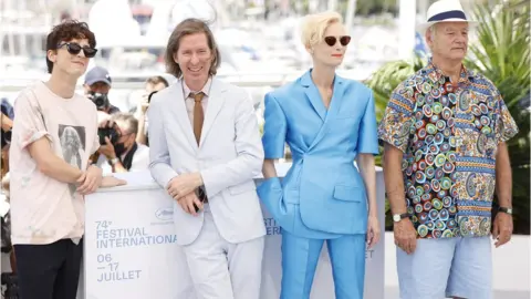 Getty Images Wes Anderson (second left) alongside French Dispatch stars Timothee Chalamet, Tilda Swinton and Bill Murray