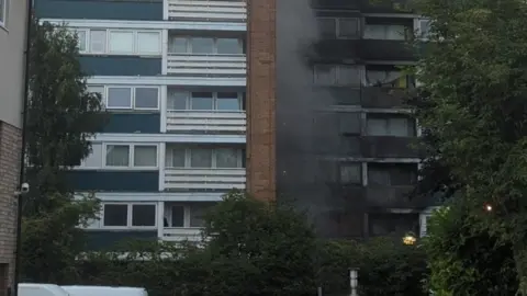 Andrew Carberry Fire damage at block of flats