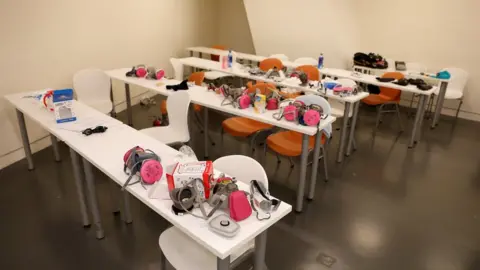 Reuters Face masks are left on a table