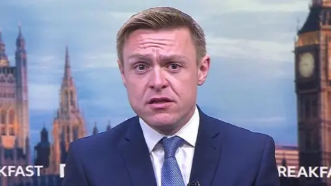 BBC Colchester MP Will Quince appearing in a television interview on BBC