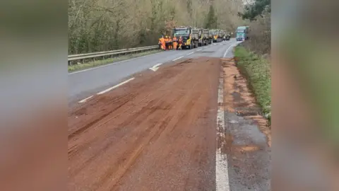 Picture of resurfaced road and sand on the road