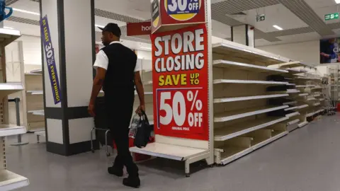 Peter Nicholls Man shopping in a Wilko store