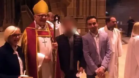 Facebook Emad Al Swealmeen during a service at Liverpool's Anglican Cathedral, alongside Bishop Cyril Ashton