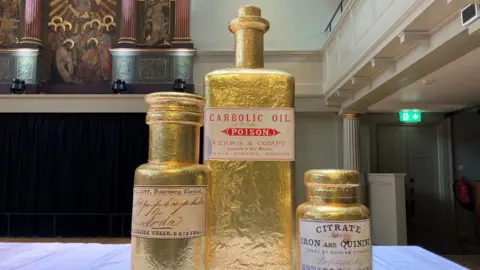 BBC Large chocolate oil bottles covered in gold foil