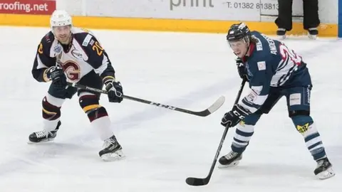Dundee captain Johan Andersson (right)