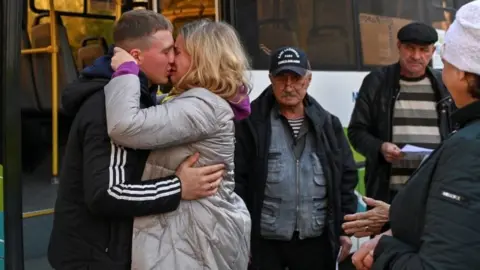 Reuters A Russian reservist bids farewell to relatives in the Siberian city of Omsk, Russia. Photo: 7 October 2022