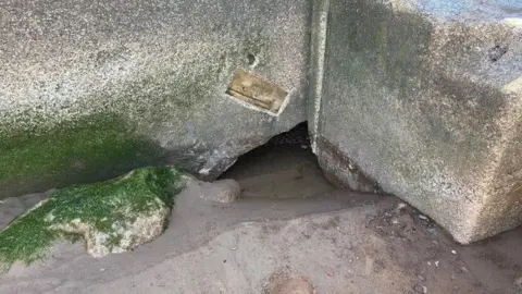 Somerset Council One of the holes discovered in the concrete sea defence