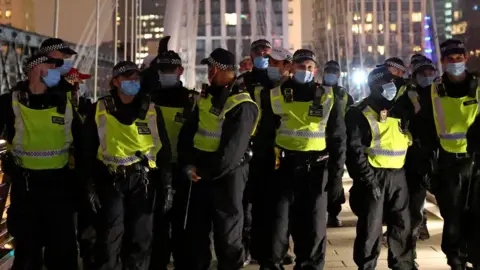 Reuters Police at an anti-lockdown protest in London on 1 January