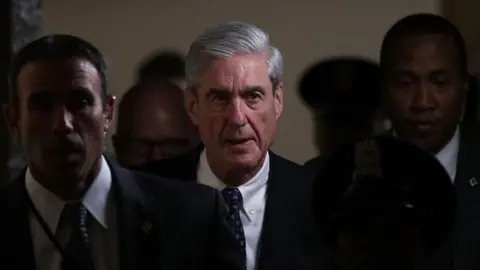 Getty Images Robert Mueller walks through the halls of Congress.