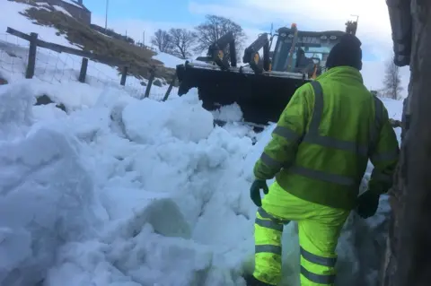 Gwen Hill Snow plough clearing a passage way in front of Gwen and Stan's house in Nenthead, Cumbria