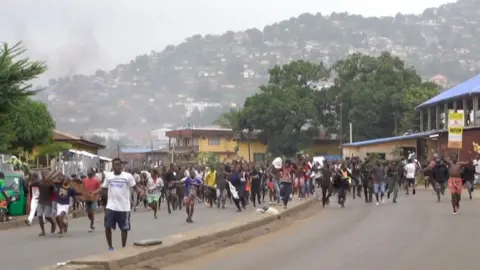 AFP Protesters take to the streets on 10 August in Freetown