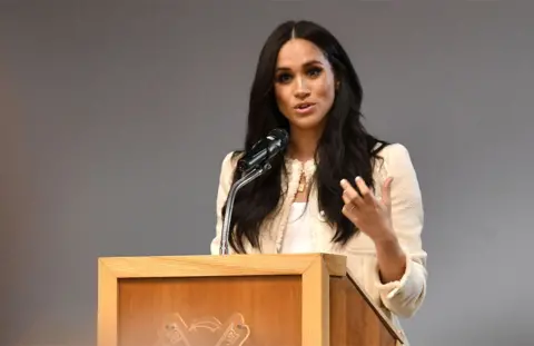 Getty Images The Duchess of Sussex gives a speech at a school in Dagenham