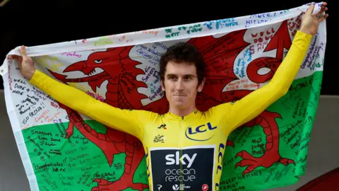 Reuters Geraint Thomas holding a Wales flag