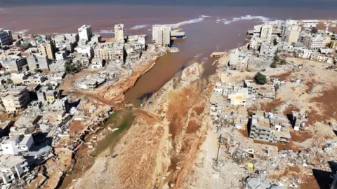 MARWAN ALFAITURI Aerial image of the mouth of the river showing the destruction.